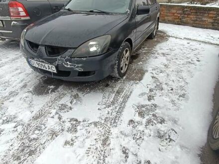 Серый Мицубиси Лансер, объемом двигателя 1.58 л и пробегом 300 тыс. км за 2550 $, фото 1 на Automoto.ua