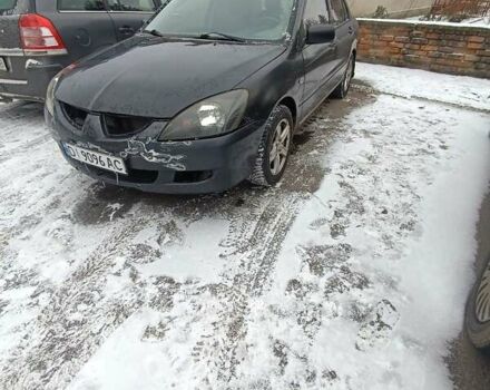 Сірий Міцубісі Lancer, об'ємом двигуна 1.58 л та пробігом 300 тис. км за 2550 $, фото 1 на Automoto.ua