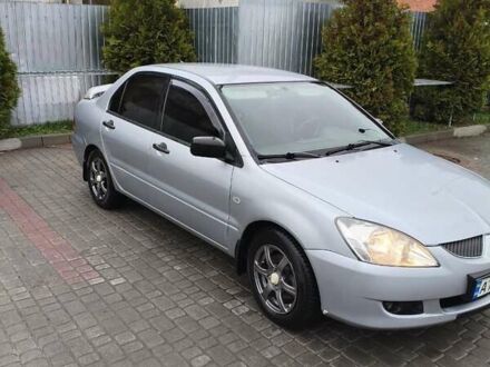 Сірий Міцубісі Lancer, об'ємом двигуна 1.58 л та пробігом 320 тис. км за 3700 $, фото 1 на Automoto.ua