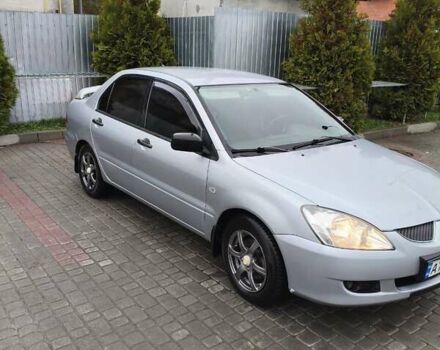 Серый Мицубиси Лансер, объемом двигателя 1.58 л и пробегом 320 тыс. км за 3700 $, фото 1 на Automoto.ua