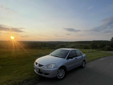 Мицубиси Лансер 2004 в Звенигородка на Automoto.ua Серый Мицубиси Лансер, объемом двигателя 1.6 л и пробегом 370 тыс. км за 4100 $, фото 1 на Automoto.ua