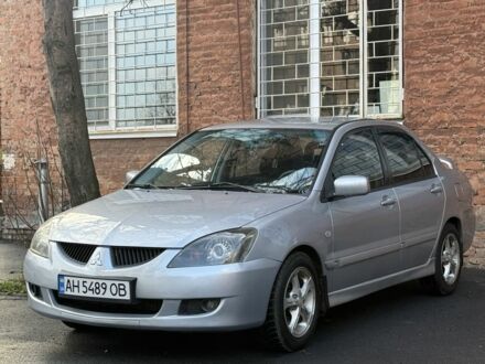 Серый Мицубиси Лансер, объемом двигателя 2 л и пробегом 180 тыс. км за 3700 $, фото 1 на Automoto.ua