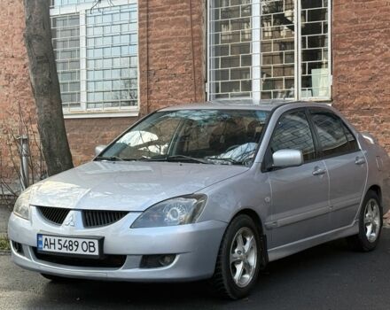 Серый Мицубиси Лансер, объемом двигателя 2 л и пробегом 180 тыс. км за 3700 $, фото 1 на Automoto.ua