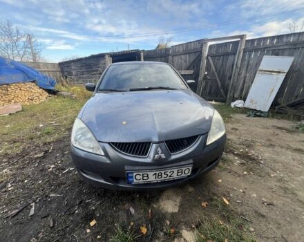 Серый Мицубиси Лансер, объемом двигателя 1.6 л и пробегом 200 тыс. км за 2400 $, фото 1 на Automoto.ua