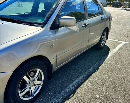 Серый Мицубиси Лансер, объемом двигателя 1.3 л и пробегом 245 тыс. км за 3000 $, фото 1 на Automoto.ua