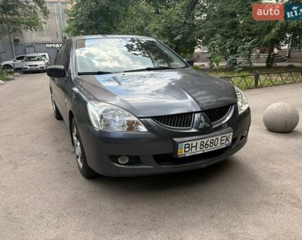 Серый Мицубиси Лансер, объемом двигателя 1.6 л и пробегом 191 тыс. км за 2400 $, фото 1 на Automoto.ua