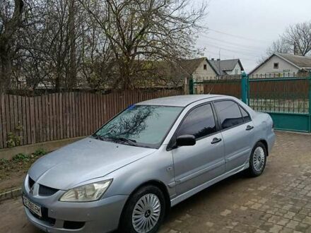 Серый Мицубиси Лансер, объемом двигателя 1.58 л и пробегом 439 тыс. км за 2500 $, фото 1 на Automoto.ua