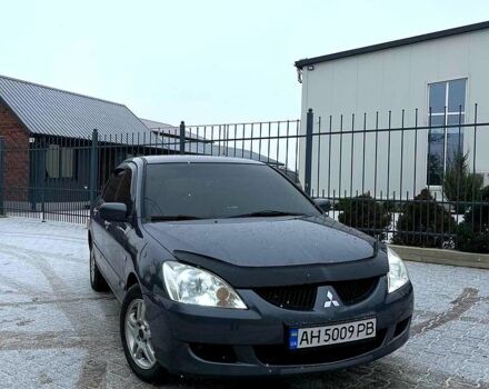 Серый Мицубиси Лансер, объемом двигателя 1.6 л и пробегом 27500 тыс. км за 4250 $, фото 1 на Automoto.ua