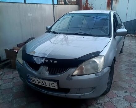 Серый Мицубиси Лансер, объемом двигателя 1.6 л и пробегом 320 тыс. км за 2600 $, фото 1 на Automoto.ua