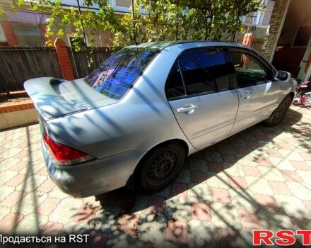 Серый Мицубиси Лансер, объемом двигателя 1.6 л и пробегом 318 тыс. км за 2900 $, фото 1 на Automoto.ua