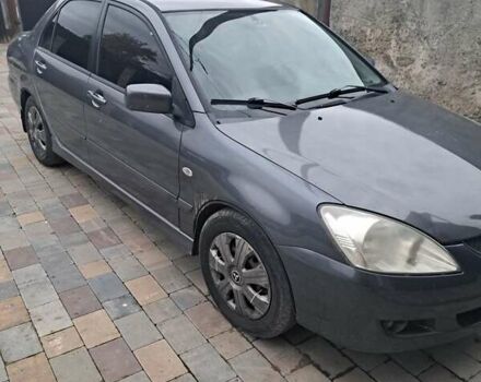 Сірий Міцубісі Lancer, об'ємом двигуна 1.58 л та пробігом 290 тис. км за 3900 $, фото 1 на Automoto.ua