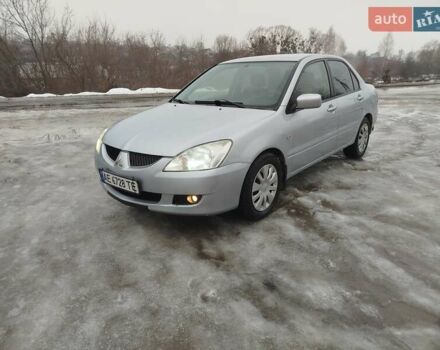 Серый Мицубиси Лансер, объемом двигателя 1.58 л и пробегом 280 тыс. км за 3800 $, фото 1 на Automoto.ua