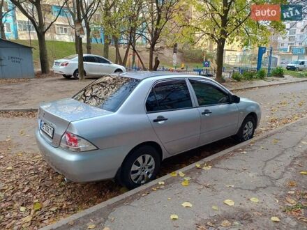 Серый Мицубиси Лансер, объемом двигателя 1.3 л и пробегом 230 тыс. км за 4000 $, фото 1 на Automoto.ua