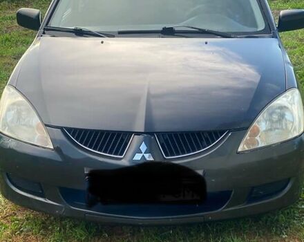 Сірий Міцубісі Lancer, об'ємом двигуна 1.58 л та пробігом 291 тис. км за 2930 $, фото 1 на Automoto.ua