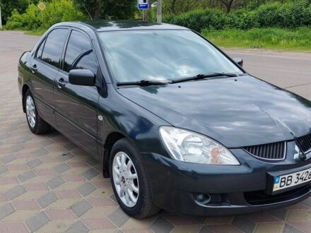 Сірий Міцубісі Lancer, об'ємом двигуна 1.6 л та пробігом 212 тис. км за 3800 $, фото 1 на Automoto.ua