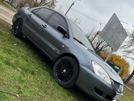 Сірий Міцубісі Lancer, об'ємом двигуна 1.58 л та пробігом 313 тис. км за 4650 $, фото 1 на Automoto.ua