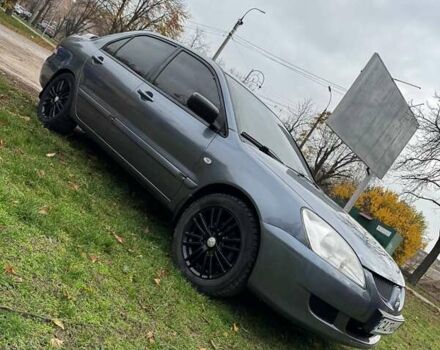 Серый Мицубиси Лансер, объемом двигателя 1.58 л и пробегом 313 тыс. км за 4650 $, фото 1 на Automoto.ua