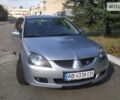 Сірий Міцубісі Lancer, об'ємом двигуна 1.6 л та пробігом 250 тис. км за 5199 $, фото 1 на Automoto.ua