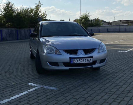 Сірий Міцубісі Lancer, об'ємом двигуна 1.58 л та пробігом 270 тис. км за 1999 $, фото 1 на Automoto.ua