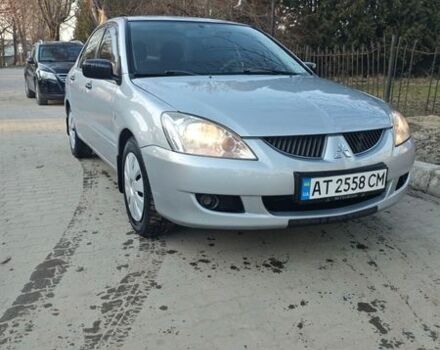 Сірий Міцубісі Lancer, об'ємом двигуна 1.58 л та пробігом 325 тис. км за 4200 $, фото 1 на Automoto.ua