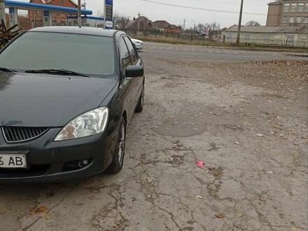 Серый Мицубиси Лансер, объемом двигателя 1.6 л и пробегом 372 тыс. км за 3500 $, фото 1 на Automoto.ua