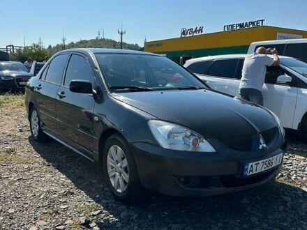 Сірий Міцубісі Lancer, об'ємом двигуна 1.58 л та пробігом 235 тис. км за 3300 $, фото 1 на Automoto.ua