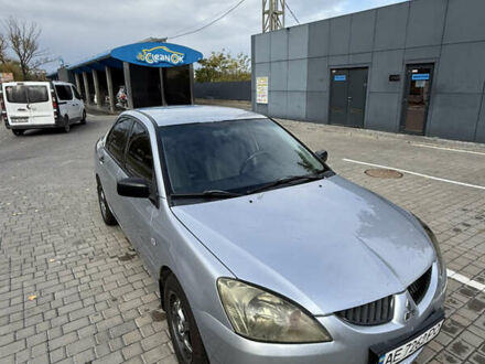 Серый Мицубиси Лансер, объемом двигателя 1.29 л и пробегом 263 тыс. км за 3400 $, фото 1 на Automoto.ua