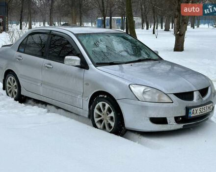 Серый Мицубиси Лансер, объемом двигателя 1.6 л и пробегом 256 тыс. км за 3700 $, фото 1 на Automoto.ua