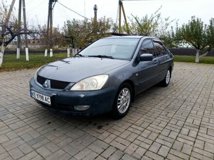 Серый Мицубиси Лансер, объемом двигателя 1.6 л и пробегом 100 тыс. км за 3500 $, фото 1 на Automoto.ua