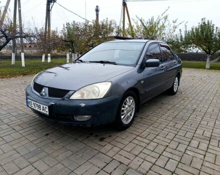 Серый Мицубиси Лансер, объемом двигателя 1.6 л и пробегом 100 тыс. км за 3500 $, фото 1 на Automoto.ua