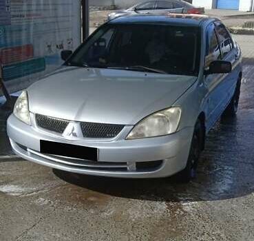 Серый Мицубиси Лансер, объемом двигателя 1.59 л и пробегом 60 тыс. км за 3000 $, фото 1 на Automoto.ua