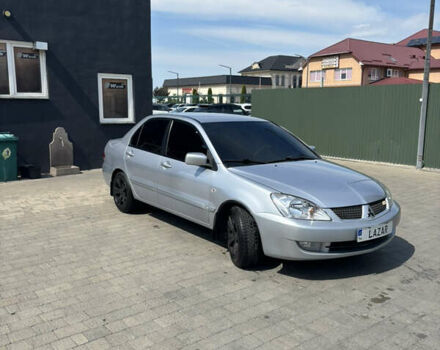 Сірий Міцубісі Lancer, об'ємом двигуна 1.58 л та пробігом 108 тис. км за 5500 $, фото 1 на Automoto.ua