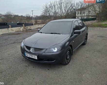 Сірий Міцубісі Lancer, об'ємом двигуна 1.6 л та пробігом 305 тис. км за 4000 $, фото 1 на Automoto.ua