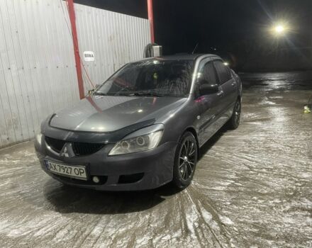 Серый Мицубиси Лансер, объемом двигателя 1.6 л и пробегом 300 тыс. км за 3600 $, фото 1 на Automoto.ua