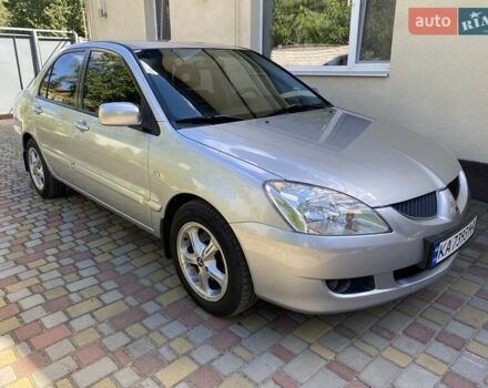 Сірий Міцубісі Lancer, об'ємом двигуна 1.58 л та пробігом 162 тис. км за 5950 $, фото 1 на Automoto.ua