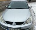 Сірий Міцубісі Lancer, об'ємом двигуна 1.6 л та пробігом 235 тис. км за 6200 $, фото 1 на Automoto.ua