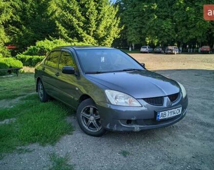 Сірий Міцубісі Lancer, об'ємом двигуна 1.58 л та пробігом 301 тис. км за 3700 $, фото 1 на Automoto.ua