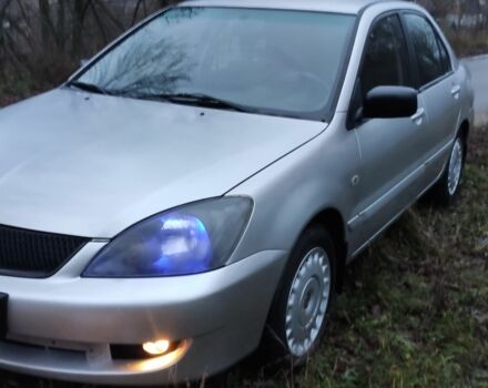 Серый Мицубиси Лансер, объемом двигателя 1.6 л и пробегом 235 тыс. км за 2850 $, фото 1 на Automoto.ua