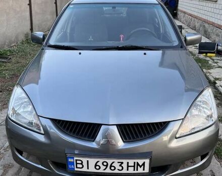 Сірий Міцубісі Lancer, об'ємом двигуна 1.58 л та пробігом 290 тис. км за 4000 $, фото 1 на Automoto.ua