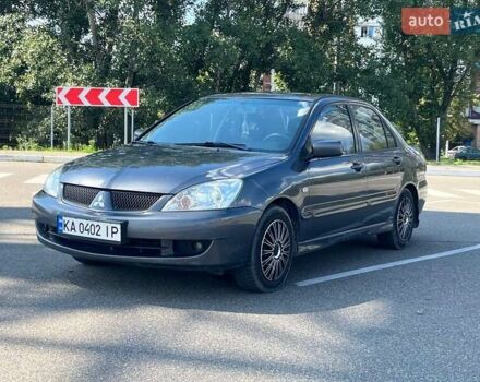 Сірий Міцубісі Lancer, об'ємом двигуна 1.58 л та пробігом 353 тис. км за 3750 $, фото 1 на Automoto.ua