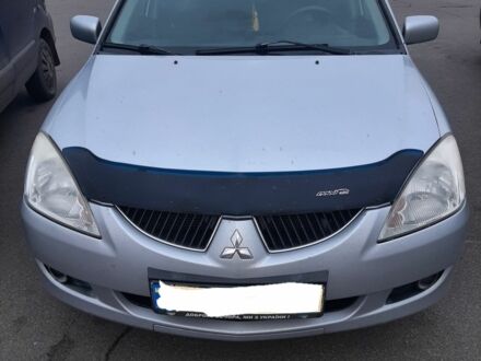 Серый Мицубиси Лансер, объемом двигателя 1.6 л и пробегом 27 тыс. км за 4200 $, фото 1 на Automoto.ua