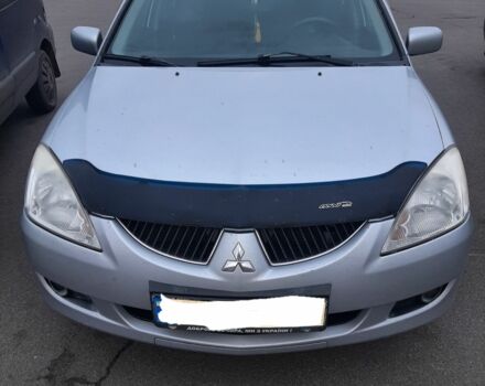 Серый Мицубиси Лансер, объемом двигателя 1.6 л и пробегом 27 тыс. км за 4200 $, фото 1 на Automoto.ua