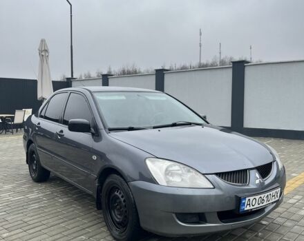 Серый Мицубиси Лансер, объемом двигателя 1.6 л и пробегом 231 тыс. км за 3500 $, фото 1 на Automoto.ua