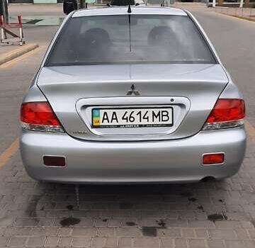 Серый Мицубиси Лансер, объемом двигателя 1.6 л и пробегом 277 тыс. км за 3500 $, фото 1 на Automoto.ua