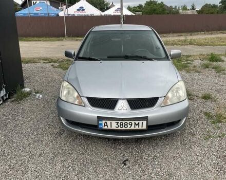 Сірий Міцубісі Lancer, об'ємом двигуна 1.58 л та пробігом 264 тис. км за 3600 $, фото 1 на Automoto.ua