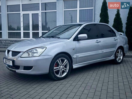 Серый Мицубиси Лансер, объемом двигателя 2 л и пробегом 187 тыс. км за 4600 $, фото 1 на Automoto.ua