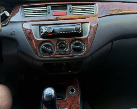 Сірий Міцубісі Lancer, об'ємом двигуна 1.58 л та пробігом 200 тис. км за 2800 $, фото 1 на Automoto.ua