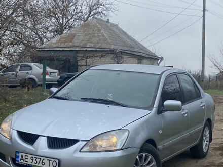 Сірий Міцубісі Lancer, об'ємом двигуна 1.58 л та пробігом 210 тис. км за 3900 $, фото 1 на Automoto.ua