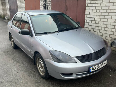 Сірий Міцубісі Lancer, об'ємом двигуна 1.58 л та пробігом 235 тис. км за 4500 $, фото 1 на Automoto.ua