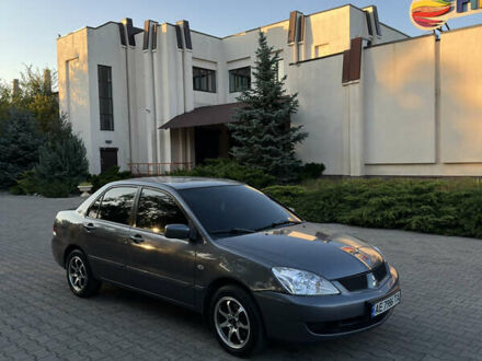 Сірий Міцубісі Lancer, об'ємом двигуна 1.58 л та пробігом 263 тис. км за 4099 $, фото 1 на Automoto.ua